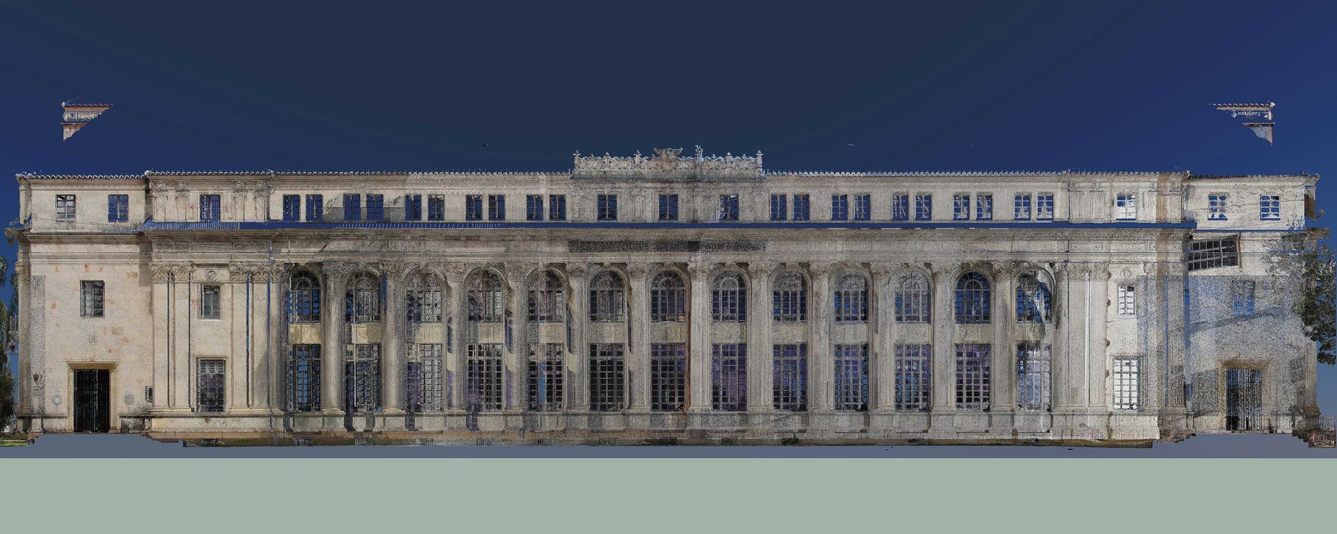 façade d'un grand bâtiment reconstituée en nuage de points après un relevé au scanner laser 3D